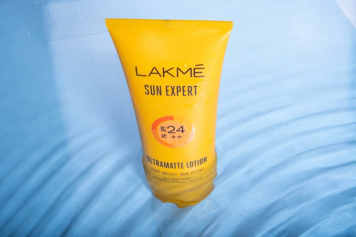Close-up of sun-friendly shampoo bottle showing UV protection ingredients label